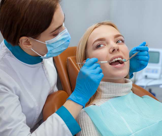 a patient receiving an emergency dental treatment from a dentist